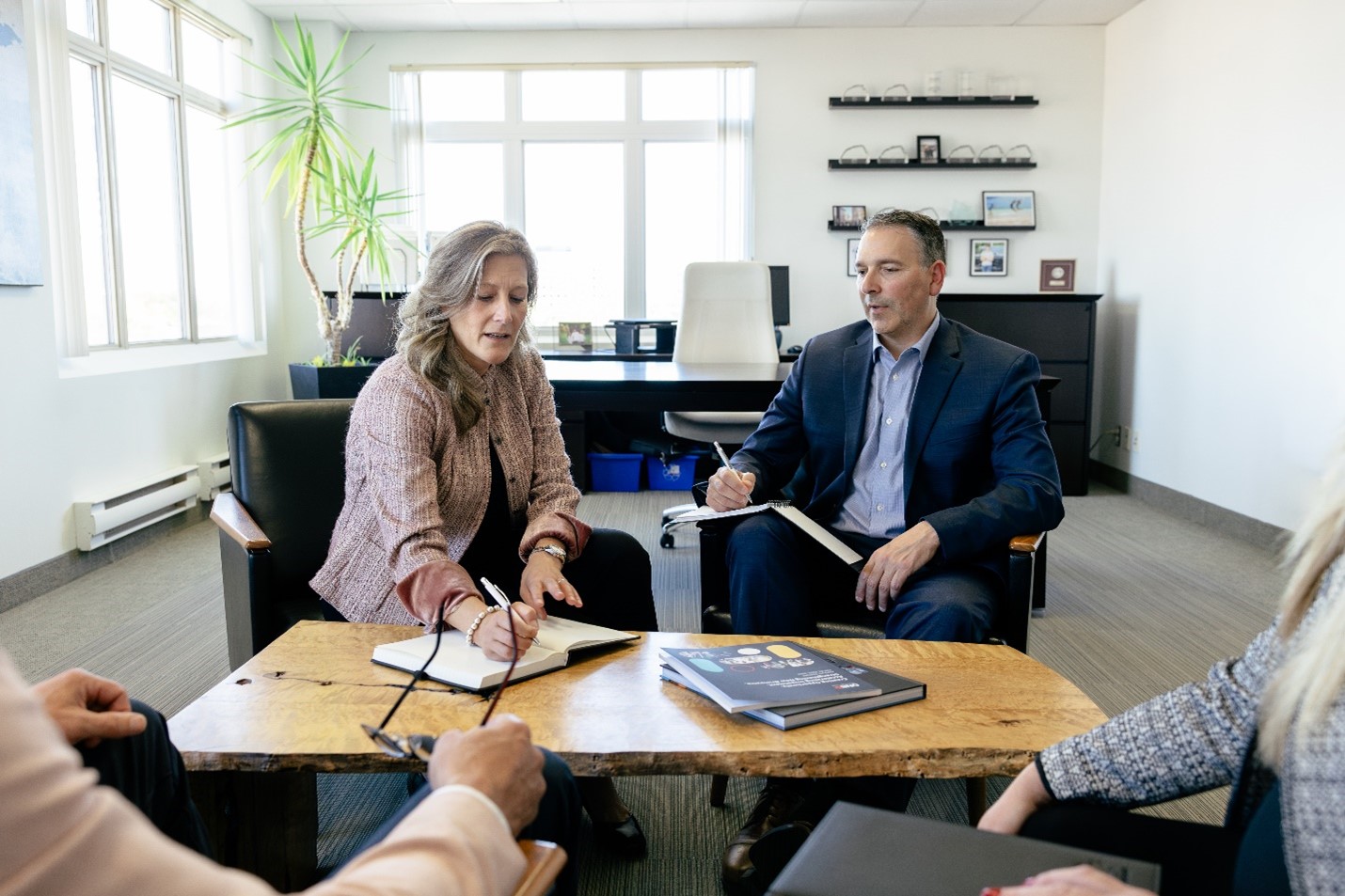 Traci and Steve sitting in the office